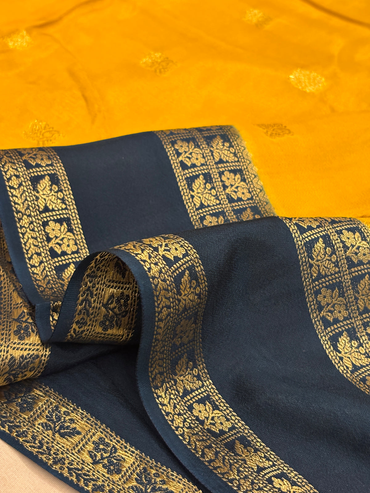 Mustard Yellow Crepe Silk Saree with Zari Buti & Midnight Navy Blue Striped Border