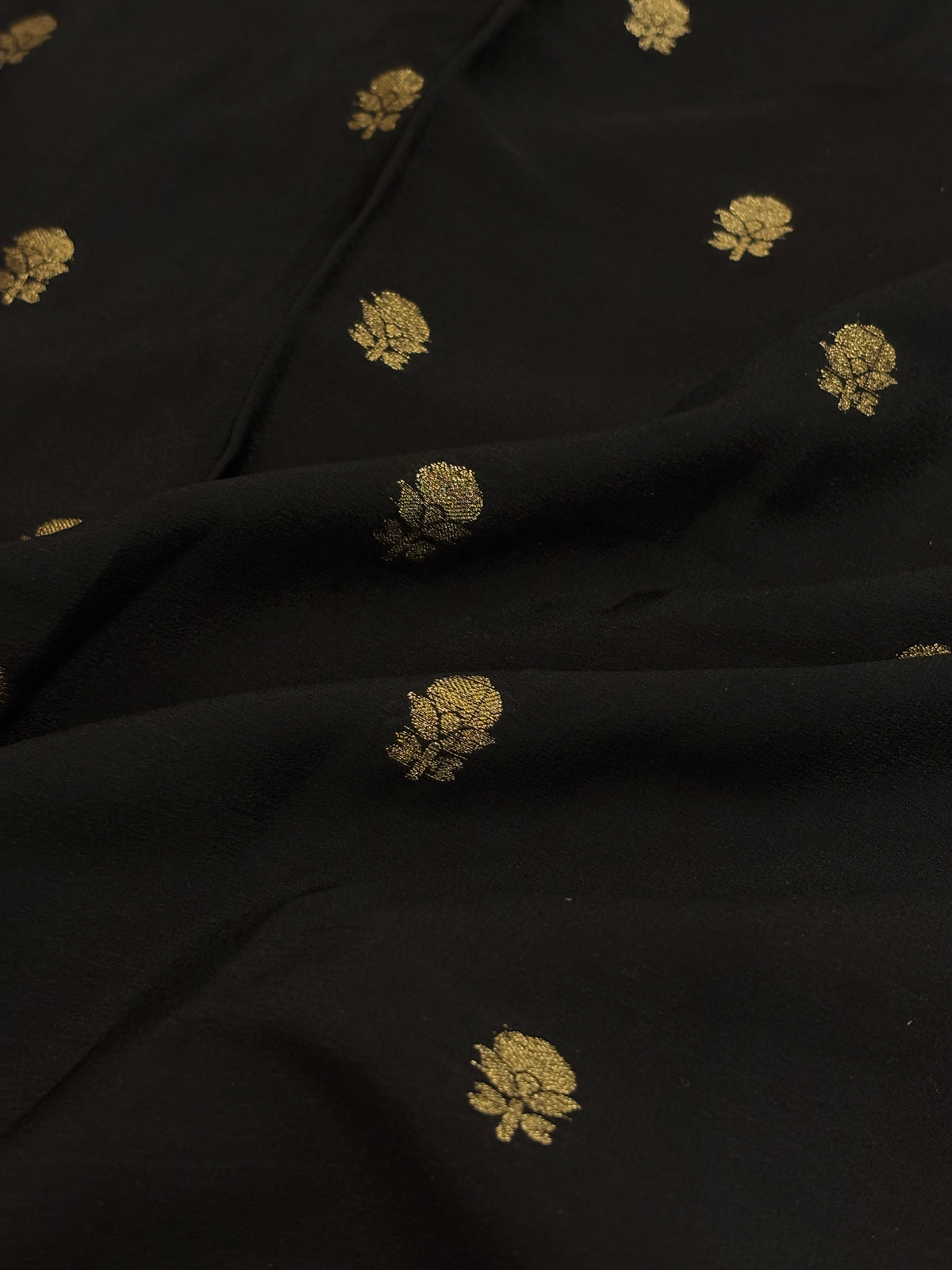 Jet Black Crepe Silk Saree with Gold Zari Buti & Coral Peach Brocade Border